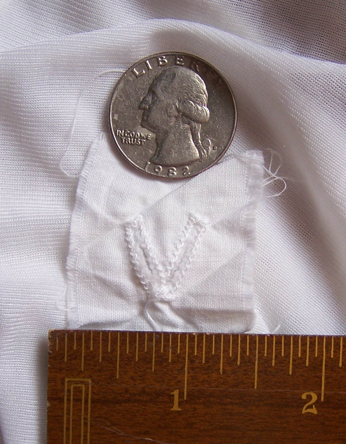 Mormon temple garment female compass marking inside stitching.