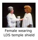 Female dressed in Mormon LDS temple shield during washing and annointing.